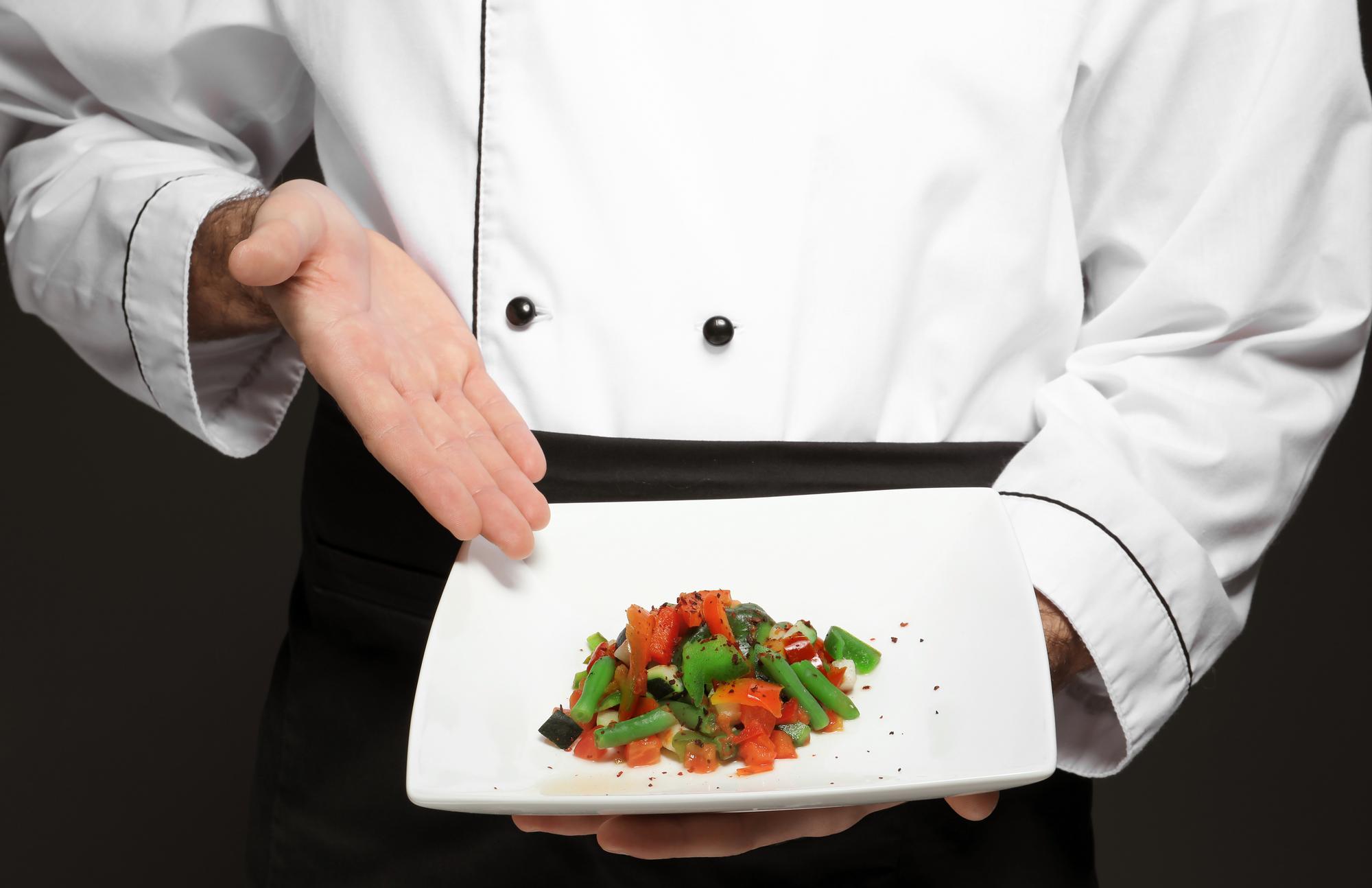 Chef preparing plated modern meal using smart kitchen tools